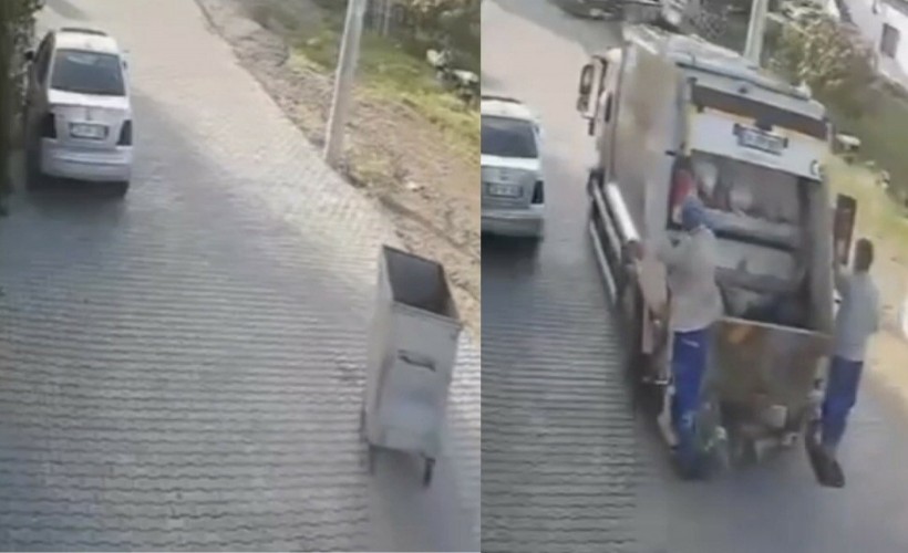 Çöp konteyneri çöp kamyonun peşinden sürüklendi; o anlar kamerada