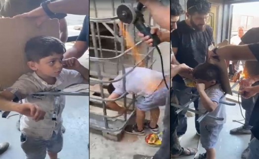 Girmeye çalıştığı kafesin demir parmaklıklarında sıkışan çocuk kurtarıldı