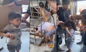 Girmeye çalıştığı kafesin demir parmaklıklarında sıkışan çocuk kurtarıldı