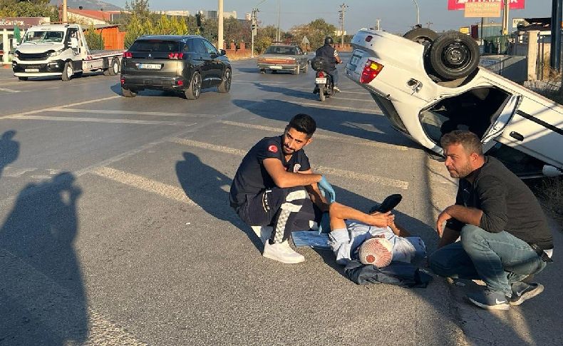 İzmir’de otomobil yol kenarını devrildi; 2 kişi yaralandı
