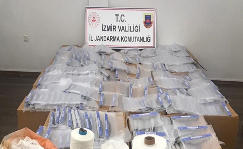 İzmir'de kaçak üretilen maske ve koruyucu siperliklere el kondu