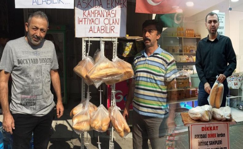MHP Bayraklı elini taşın altına koydu: 'Askıda ekmek' kampanyasına destek